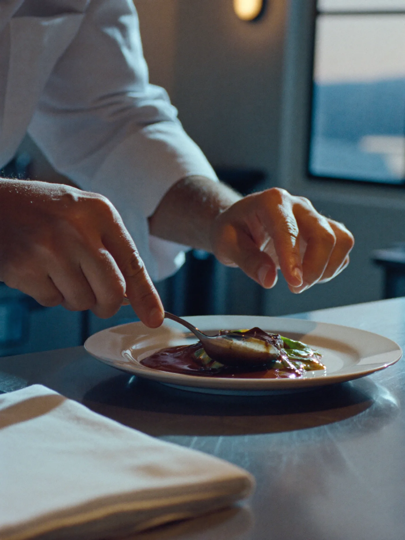 Chef hands finishing a plate